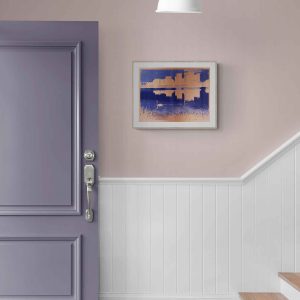 A purple door with a silver handle beside a staircase featuring wooden steps and white paneling. A purple and copper abstract print of a swan swimming at Walthamstow wetlands hangs on the wall.