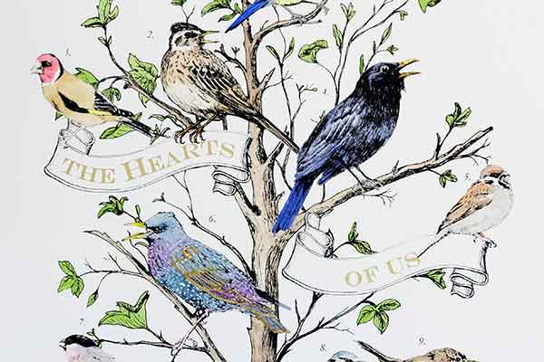 Illustration of a tree with colorful birds, each perched on branches with green leaves. A ribbon with the words "The Hearts of Us" weaves through the tree.